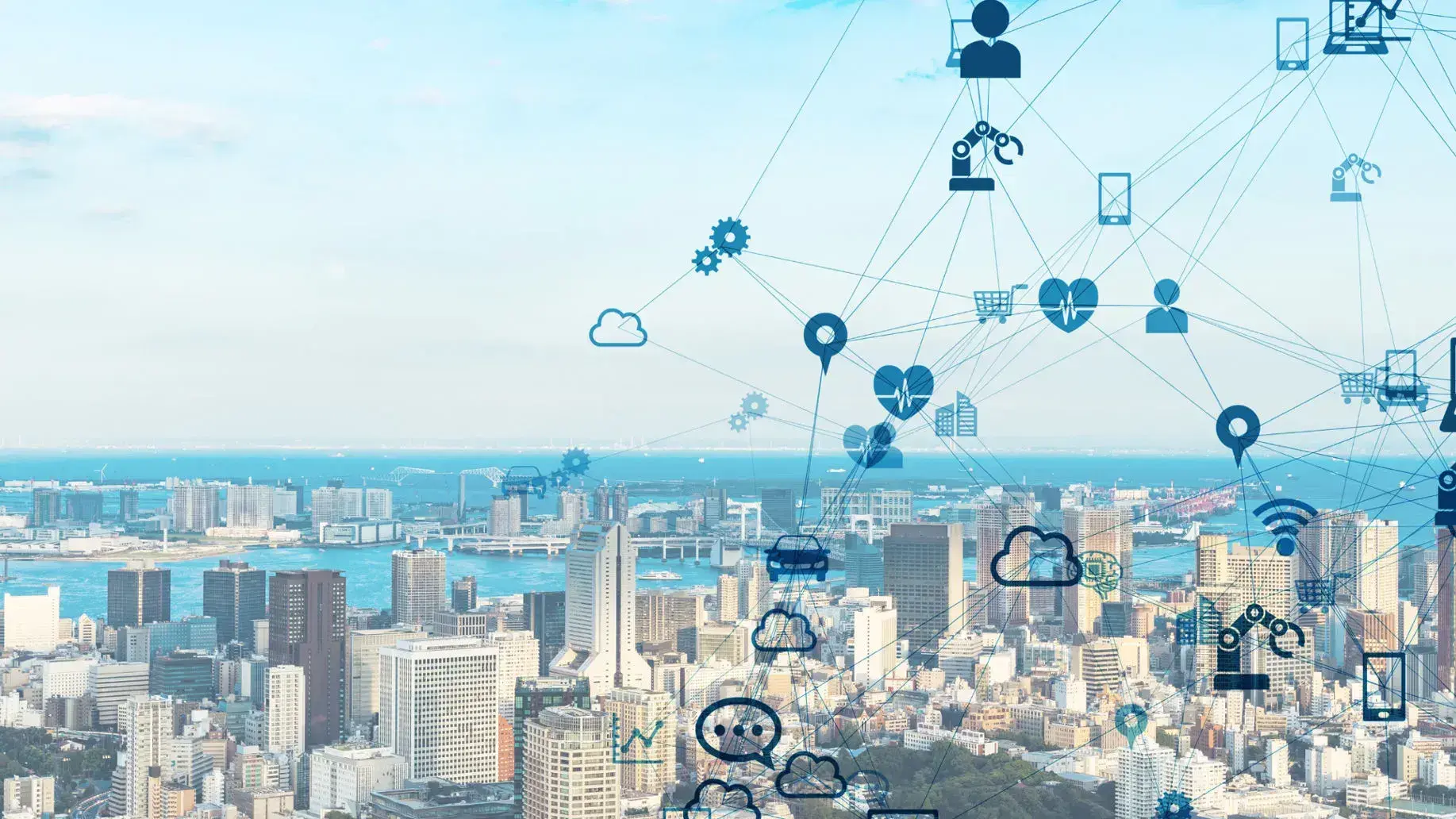 Overlay of digital icons, like clouds and gears, connected by lines over a grayscale cityscape, symbolizing urban connectivity and technology integration.