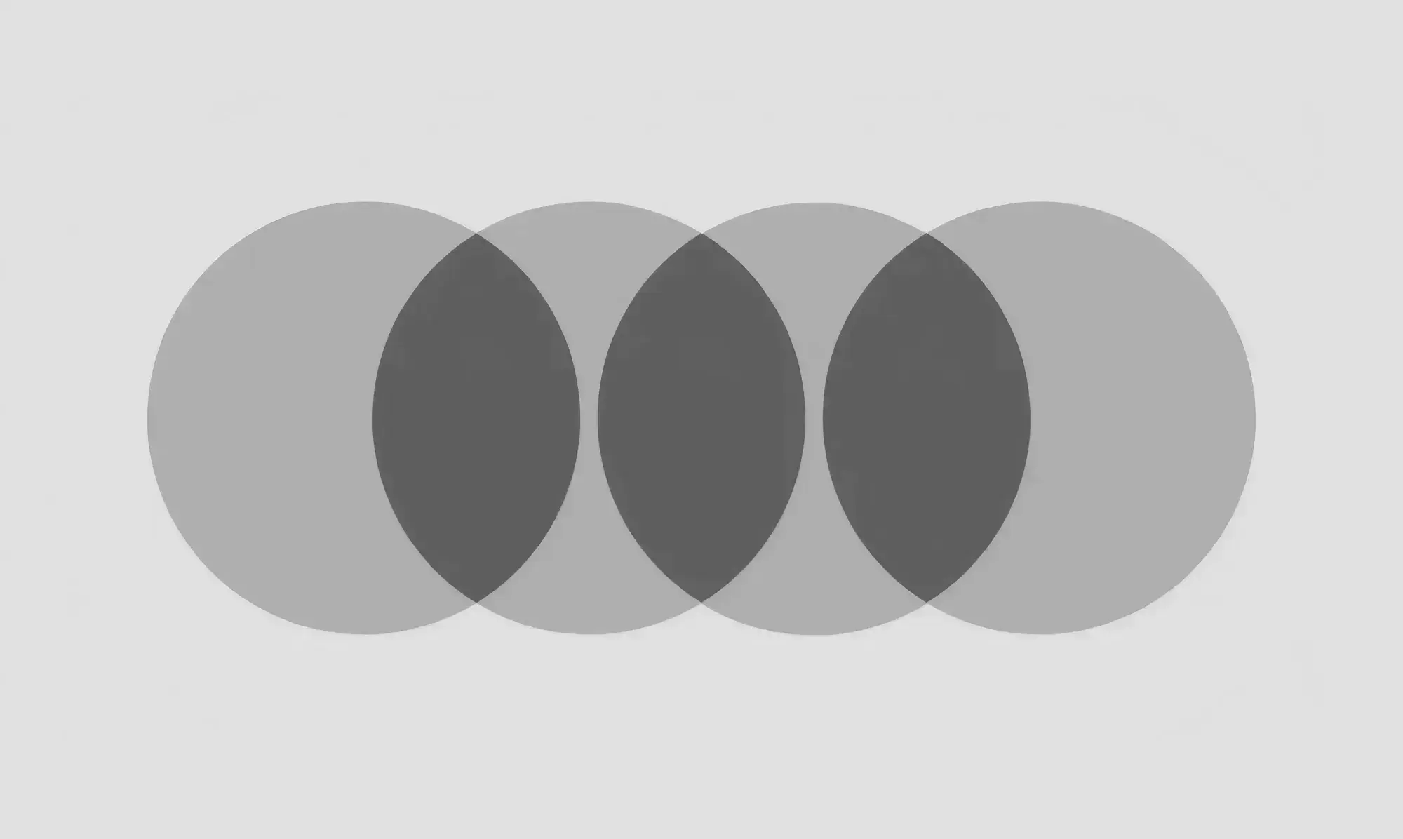 Overlapping dark gray circles in a horizontal line on a light gray background. The composition is abstract, creating a sense of symmetry and balance.